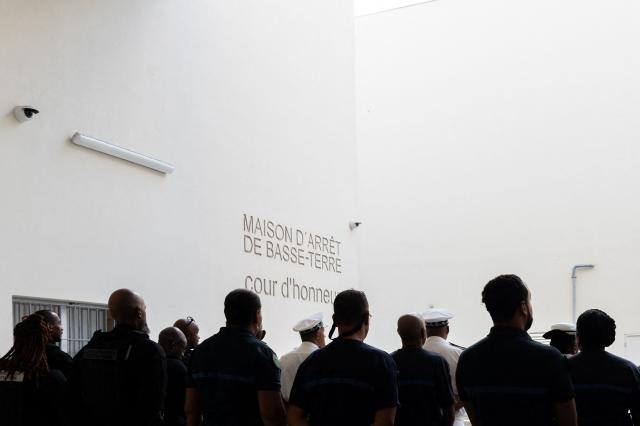 France's Minister of Justice Gerald Darmanin walks in the detention center of Basse-Terre in the French archipelago of Guadeloupe, on December 7, 2025. The French Minister of Justice inaugurated on December 7, 2025 in Basse-Terre, the prefecture of the Guadeloupe archipelago, the new detention center that had been under construction for several years. (Photo by Carla Bernhardt / AFP)