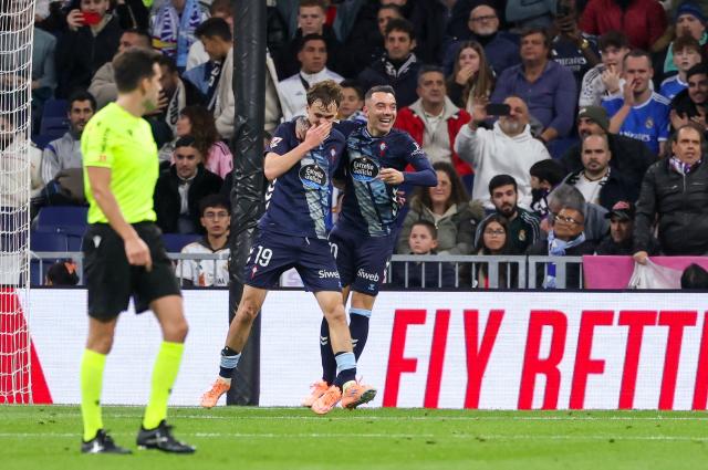 Celta Vigo's Swedish forward #19 Williot Swedberg (L) celebrates scoring his team's second goal during the Spanish league football match between Real Madrid CF and RC Celta de Vigo at the Santiago Bernabeu Stadium in Madrid on December 7, 2025. (Photo by Thomas COEX / AFP)