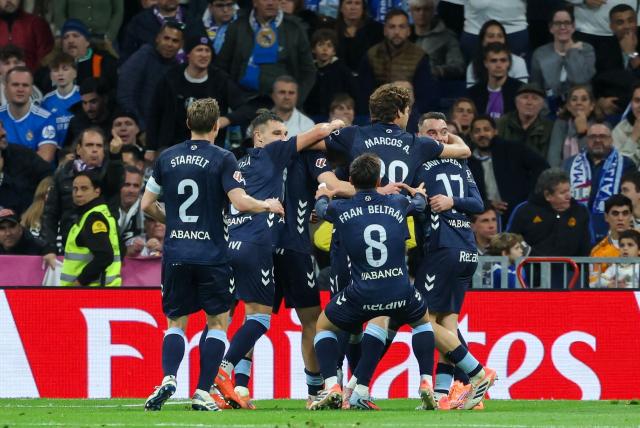 Celta de Vigo players celebrate scoring their team's second goal during the Spanish league football match between Real Madrid CF and RC Celta de Vigo at the Santiago Bernabeu Stadium in Madrid on December 7, 2025. (Photo by Thomas COEX / AFP)