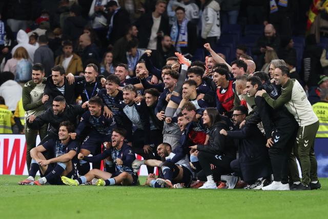 Celta de Vigo players pose at the end of the Spanish league football match between Real Madrid CF and RC Celta de Vigo at the Santiago Bernabeu Stadium in Madrid on December 7, 2025. (Photo by Thomas COEX / AFP)