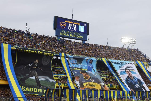 Boca Juniors fans cheer for their team ahead of the Argentine Professional Football League 2025 Clausura Tournament semifinal match between Boca Juniors and Racing at La Bombonera Stadium in Buenos Aires on December 7, 2025. (Photo by ALEJANDRO PAGNI / AFP)
