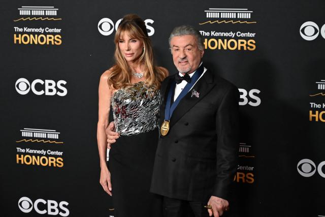 US actor and Kennedy Center Honoree Sylvester Stallone and his wife Jennifer Flavin arrive for the 48th Kennedy Center Honors gala at the Kennedy Center in Washington, DC, on December 7, 2025. (Photo by Alex WROBLEWSKI / AFP)