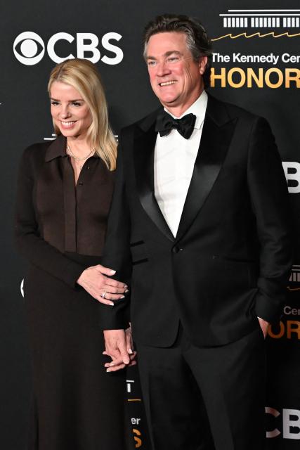 US Attorney General Pam Bondi and John Wakefield arrive for the 48th Kennedy Center Honors gala at the Kennedy Center in Washington, DC, on December 7, 2025. (Photo by Alex WROBLEWSKI / AFP)
