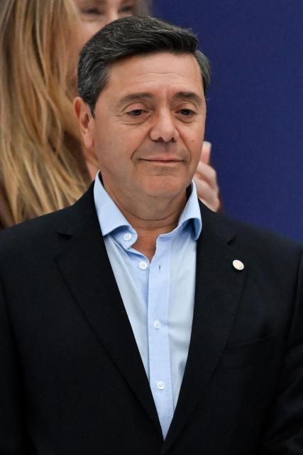 Argentina’s new Defence Minister Carlos Presti poses for a photo on the podium of the 132nd Argentine Polo Open tournament at the Palermo polo field in Buenos Aires on December 7, 2025. (Photo by Luis ROBAYO / AFP)