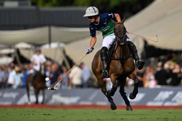 La Natividad La Dolfina Argentinian polo player Camilo Castagnola controls the ball during the 132nd Argentine Polo Open tournament final match against Ellerstina Indios Chapaleufu at the Palermo polo field in Buenos Aires on December 7, 2025. (Photo by Luis ROBAYO / AFP)