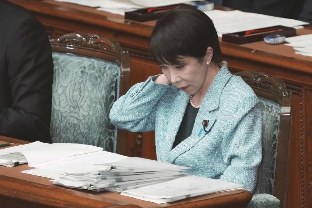 Japan's Prime Minister Sanae Takaichi attends a plenary session of the House of Representatives at the National Diet in Tokyo on December 8, 2025. (Photo by Kazuhiro NOGI / AFP)