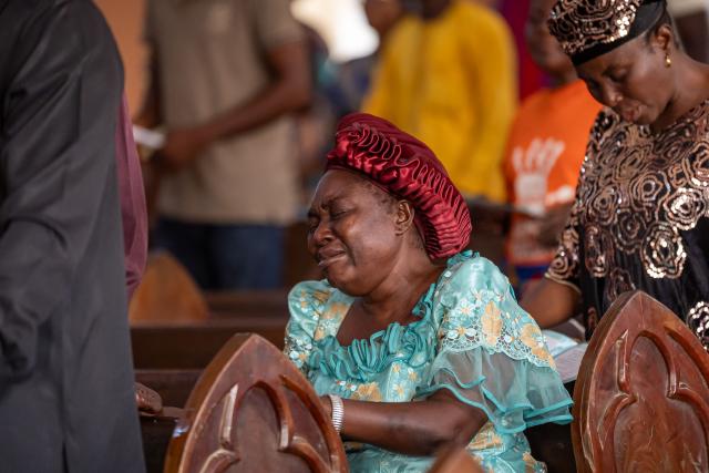 A worshipper prays at the Evangelical Church Winning All (ECWA) during a prayer called by the Christian Association of Nigeria (CAN) in Minna on December 7, 2025. Nigerian authorities have secured the release of 100 kidnapped schoolchildren taken by gunmen from a Catholic school last month, a UN source and local media said Sunday, though the fate of the 165 students and staff thought to remain in captivity remains unclear.
In late November 315 students and staff were kidnapped from St. Mary's co-educational boarding school in north-central Niger state, as the country buckled under a wave of mass abductions reminiscent of the infamous 2014 Boko Haram abduction of schoolgirls in Chibok. (Photo by Light Oriye Tamunotonye / AFP)