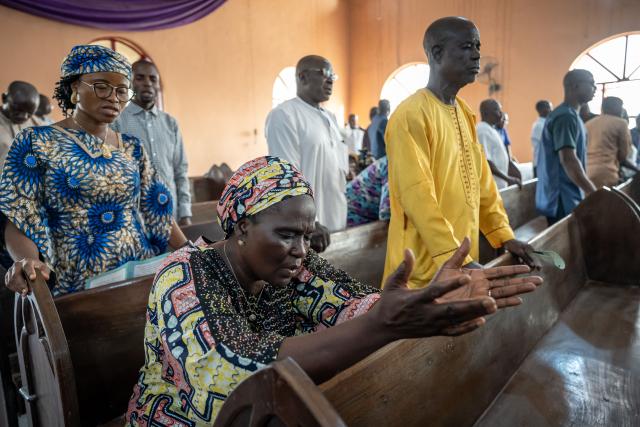 Worshippers pray at the Evangelical Church Winning All (ECWA) during a prayer called by the Christian Association of Nigeria (CAN) in Minna on December 7, 2025. Nigerian authorities have secured the release of 100 kidnapped schoolchildren taken by gunmen from a Catholic school last month, a UN source and local media said Sunday, though the fate of the 165 students and staff thought to remain in captivity remains unclear.
In late November 315 students and staff were kidnapped from St. Mary's co-educational boarding school in north-central Niger state, as the country buckled under a wave of mass abductions reminiscent of the infamous 2014 Boko Haram abduction of schoolgirls in Chibok. (Photo by Light Oriye Tamunotonye / AFP)