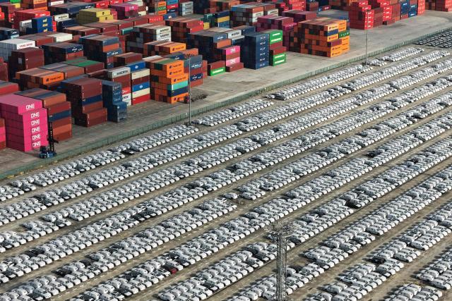 An aerial view shows vehicles awaiting to be exported at the Nanjing Port Longtan area operated by Jiangsu Port Group in Nanjing, in China's eastern Jiangsu province on December 8, 2025. (Photo by AFP) / China OUT