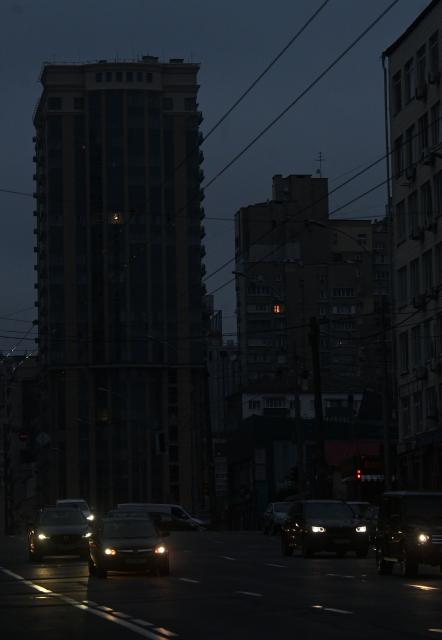 This photograph shows a view of the city of Kyiv during blackout hours on December 7, 2025, amid the Russian invasion of Ukraine. (Photo by Sergei SUPINSKY / AFP)