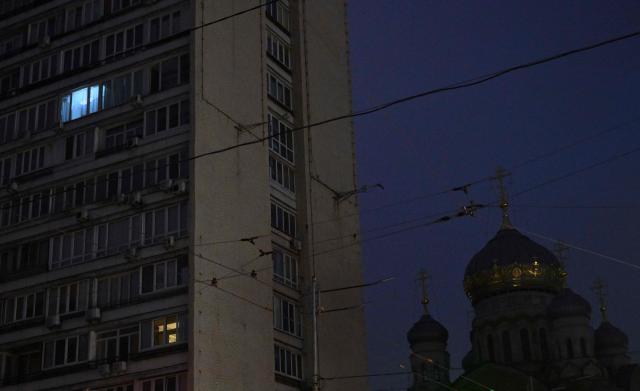 This photograph shows a view of the city of Kyiv during blackout hours on December 7, 2025, amid the Russian invasion of Ukraine. (Photo by Sergei SUPINSKY / AFP)
