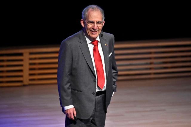 Nobel Prize winner in Physics, Michel H. Devoret speaks during the Nobel Prize Lecture in Physics in Aula Magna at Stockholm University on December 8, 2025. (Photo by Christine Olsson/TT / TT NEWS AGENCY / AFP) / Sweden OUT