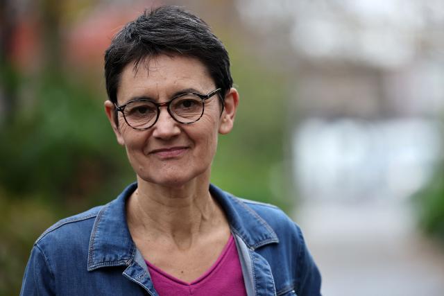 French far-left party Lutte Ouvriere (LO) spokesperson Nathalie Arthaud poses prior a press conference after the LO congress on the international and national situation, as well as its participation in the upcoming municipal and presidential elections, in Paris on December 8, 2025. Nathalie Arthaud announced on December 8, 2025 that she would be running for president in 2027, her fourth bid since 2012. (Photo by Anne-Christine POUJOULAT / AFP)