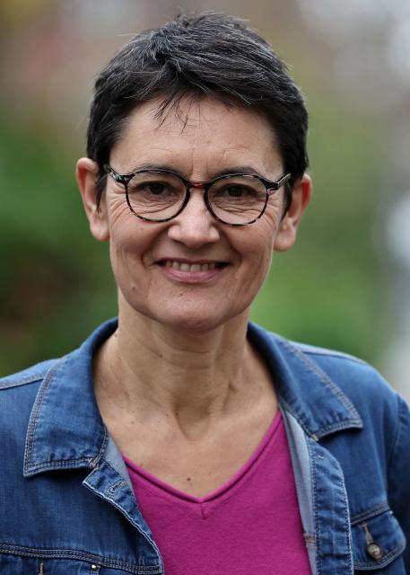 French far-left party Lutte Ouvriere (LO) spokesperson Nathalie Arthaud poses prior a press conference after the LO congress on the international and national situation, as well as its participation in the upcoming municipal and presidential elections, in Paris on December 8, 2025. Nathalie Arthaud announced on December 8, 2025 that she would be running for president in 2027, her fourth bid since 2012. (Photo by Anne-Christine POUJOULAT / AFP)