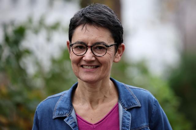 French far-left party Lutte Ouvriere (LO) spokesperson Nathalie Arthaud poses prior a press conference after the LO congress on the international and national situation, as well as its participation in the upcoming municipal and presidential elections, in Paris on December 8, 2025. Nathalie Arthaud announced on December 8, 2025 that she would be running for president in 2027, her fourth bid since 2012. (Photo by Anne-Christine POUJOULAT / AFP)