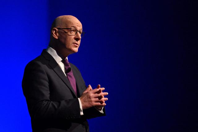 Scotland's First Minister John Swinney speaks during the Scottish National Party (SNP)'s opening campaign launch in Glasgow on December 8, 2025, ahead of planned elections in May 2026. (Photo by ANDY BUCHANAN / AFP)
