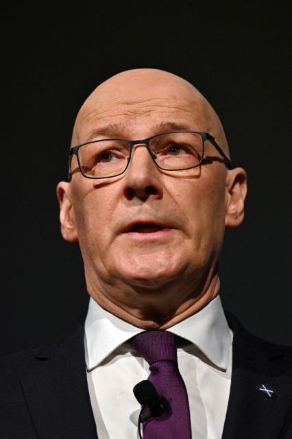 Scotland's First Minister John Swinney speaks during the Scottish National Party (SNP)'s opening campaign launch in Glasgow on December 8, 2025, ahead of planned elections in May 2026. (Photo by ANDY BUCHANAN / AFP)