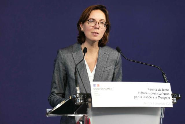 France's Public Accounts Minister Amelie de Montchalin, next to Minister of Culture, Sports, Tourism and Youth of Mongolia (not pictured), holds a press conference during the handover of prehistoric cultural artifacts to Mongolian authorities at the Ministry of the Economy and Finance building (Bercy), in Paris on December 8, 2025. (Photo by Dimitar DILKOFF / AFP)