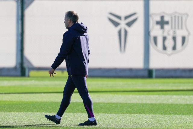Barcelona's German coach Hans-Dieter Flick arrives for a training session on the eve of the UEFA Champions League league phase day 6 football match between FC Barcelona and Eintracht Frankfurt at the Joan Gamper training ground in Sant Joan Despi, near Barcelona, on December 8, 2025. (Photo by Lluis GENE / AFP)