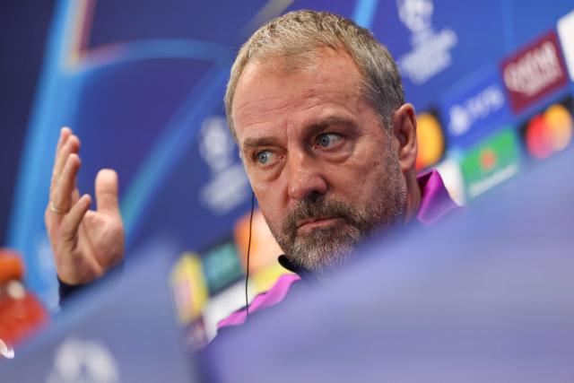 Barcelona's German coach Hans-Dieter Flick gestures during a press conference on the eve of the UEFA Champions League league phase day 6 football match between FC Barcelona and Eintracht Frankfurt at the Joan Gamper training ground in Sant Joan Despi, near Barcelona, on December 8, 2025. (Photo by Lluis GENE / AFP)