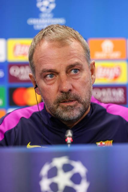 Barcelona's German coach Hans-Dieter Flick looks on during a press conference on the eve of the UEFA Champions League league phase day 6 football match between FC Barcelona and Eintracht Frankfurt at the Joan Gamper training ground in Sant Joan Despi, near Barcelona, on December 8, 2025. (Photo by Lluis GENE / AFP)