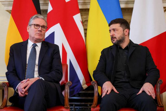 Britain's Prime Minister Keir Starmer (L) and Ukraine's President Volodymyr Zelensky take part in meetings with their French and German counterparts at Number 10 Downing Street in central London on December 8, 2025. (Photo by Toby Melville / POOL / AFP)