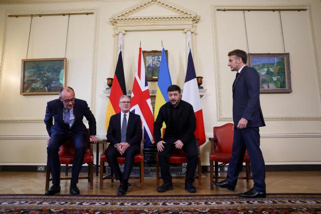 (L to R) Germany's Chancellor Friedrich Merz, Britain's Prime Minister Keir Starmer, Ukraine's President Volodymyr Zelensky and French President Emmanuel Macron take part in meetings at Number 10 Downing Street in central London on December 8, 2025. (Photo by Toby Melville / POOL / AFP)