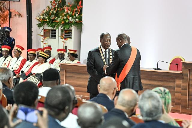 Ivory Coast President Alassane Ouattara is inaugurated at the Presidential Palace in Abidjan on December 8, 2025. (Photo by SIA KAMBOU / POOL / AFP)