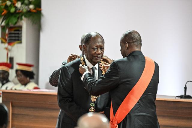 TOPSHOT - Ivory Coast President Alassane Ouattara is inaugurated at the Presidential Palace in Abidjan on December 8, 2025. (Photo by SIA KAMBOU / POOL / AFP)
