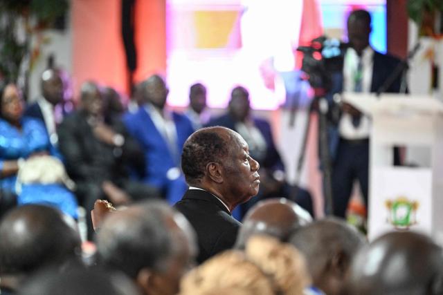Ivory Coast President Alassane Ouattara looks on while at the Presidential Palace during his inauguration ceremony in Abidjan on December 8, 2025. (Photo by SIA KAMBOU / POOL / AFP)