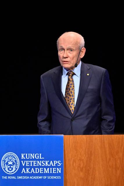Laureate of The Sveriges Riksbank Prize in Economic Sciences 2025 Canadian economist Peter Howitt gives his lecture in Economic Science at the Aula Magna at Stockholm University in Stockholm, Sweden, on December 8, 2025. (Photo by Christine OLSSON / TT News Agency / AFP) / Sweden OUT