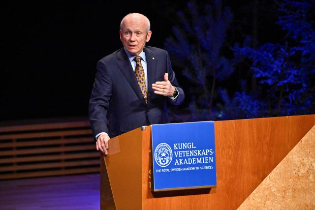 Laureate of The Sveriges Riksbank Prize in Economic Sciences 2025 Canadian economist Peter Howitt gives his lecture in Economic Science at the Aula Magna at Stockholm University in Stockholm, Sweden, on December 8, 2025. (Photo by Christine OLSSON / TT News Agency / AFP) / Sweden OUT