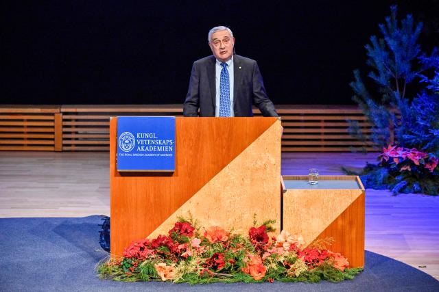 Laureate of The Sveriges Riksbank Prize in Economic Sciences 2025 US-Israeli economic historian Joel Mokyr gives a lecture at the Aula Magna at Stockholm University in Stockholm, Sweden, on December 8, 2025. Laureates will receive their Nobel prizes at formal ceremonies in Stockholm and Oslo on December 10. That date is the anniversary of the death in 1896 of scientist Alfred Nobel, who created the prizes in his will. (Photo by Christine OLSSON / TT NEWS AGENCY / AFP) / Sweden OUT