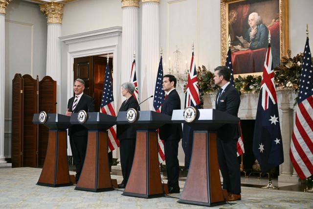 (L/R) Australian Deputy Prime Minister and Defense Minister Richard Marles, Australian Foreign Minister Penny Wong, US Secretary of State Marco Rubio, and US Secretary of Defense Pete Hegseth deliver remarks during the 35th Australia-US Ministerial Consultations (AUSMIN) at the State Department in Washington, DC, on December 8, 2025. (Photo by Brendan SMIALOWSKI / AFP)