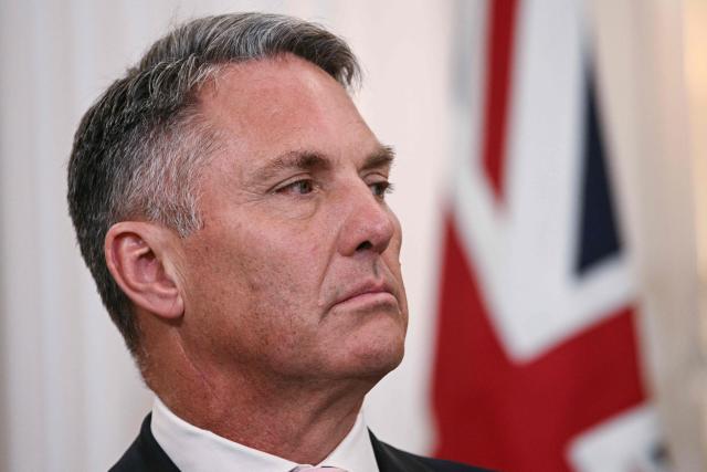 Australian Deputy Prime Minister and Defense Minister Richard Marles looks on as Australian Foreign Minister Penny Wong delivers remarks during the 35th Australia-US Ministerial Consultations (AUSMIN) at the State Department in Washington, DC, on December 8, 2025. (Photo by Brendan SMIALOWSKI / AFP)