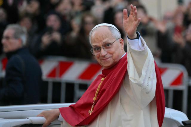Pope Leo XIV waves to the crowd from the popemobile at the Spanish steps as he arrives to pay homage to the Immaculate Conception, in Rome, on December 8, 2025. (Photo by Tiziana FABI / AFP)