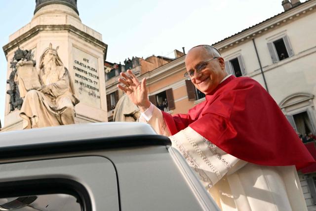 Pope Leo XIV waves to the crowd from the popemobile as he leaves after paying homage to the Immaculate Conception, near the Spanish steps in Rome, on December 8, 2025. (Photo by Alberto PIZZOLI / AFP)