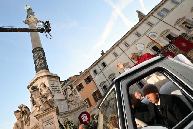 Pope Leo XIV waves to the crowd from the popemobile as he leaves after paying homage to the Immaculate Conception, near the Spanish steps in Rome, on December 8, 2025. (Photo by Alberto PIZZOLI / AFP)