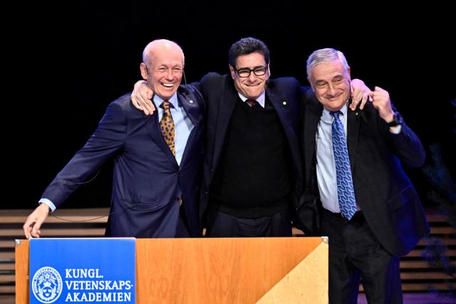 Laureates of The Sveriges Riksbank Prize in Economic Sciences 2025 (LtoR) Canadian economist Peter Howitt, French economist Philippe Aghion and US-Israeli economic historian Joel Mokyr react after their lectures at the Aula Magna at Stockholm University in Stockholm, Sweden, on December 8, 2025. Laureates will receive their Nobel prizes at formal ceremonies in Stockholm and Oslo on December 10. That date is the anniversary of the death in 1896 of scientist Alfred Nobel, who created the prizes in his will. (Photo by Christine OLSSON / TT NEWS AGENCY / AFP) / Sweden OUT