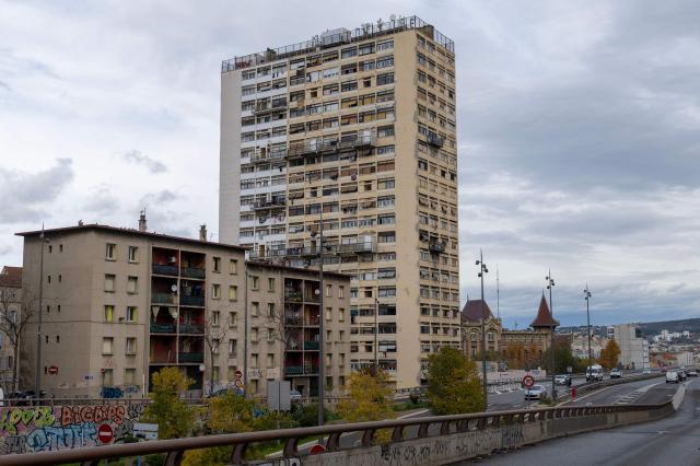 (FILES) This photograph shows a view of The Bel Horizon tower located in the 3rd arrondissement of Marseille, on December 3, 2025. In the poorest major city in France, drug-related murders no longer necessarily occur at night, away from prying eyes. Of the 17 that have taken place since January, five occurred during the day, on busy streets, in front of helpless witnesses, according to an AFP tally. In the lobby of the Bel Horizon tower in Marseille, the phone number of the Avad association (Aid for victims of criminal acts) is posted after the death in late November of a young man, riddled with bullets at a drug dealing spot at the building's entrance, who came to seek refuge in its upper floors. (Photo by Miguel MEDINA / AFP)