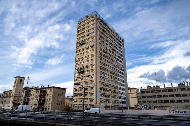 (FILES) This photograph shows a view of The Bel Horizon tower located in the 3rd arrondissement of Marseille, on December 3, 2025. In the poorest major city in France, drug-related murders no longer necessarily occur at night, away from prying eyes. Of the 17 that have taken place since January, five occurred during the day, on busy streets, in front of helpless witnesses, according to an AFP tally. In the lobby of the Bel Horizon tower in Marseille, the phone number of the Avad association (Aid for victims of criminal acts) is posted after the death in late November of a young man, riddled with bullets at a drug dealing spot at the building's entrance, who came to seek refuge in its upper floors. (Photo by MIGUEL MEDINA / AFP)