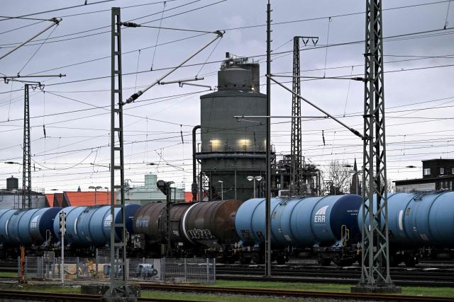 Railway tank cars with the logo of ERR European Rail Rent are pictured in an industrial area in Frankfurt am Main, western Germany, on December 8, 2025. (Photo by Kirill KUDRYAVTSEV / AFP)