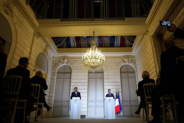 France's President Emmanuel Macron (L) and Croatia's Prime Minister Andrej Plenkovic give a press conference after their meeting at the Elysee Palace in Paris, on December 8, 2025. (Photo by Gonzalo Fuentes / POOL / AFP)