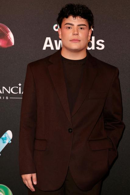 TikToker known as "Richard2609" poses during the photocall before the third edition of the Tiktok Awards ceremony at the Lido cabaret, in Paris on December 8, 2025. (Photo by Thomas SAMSON / AFP)