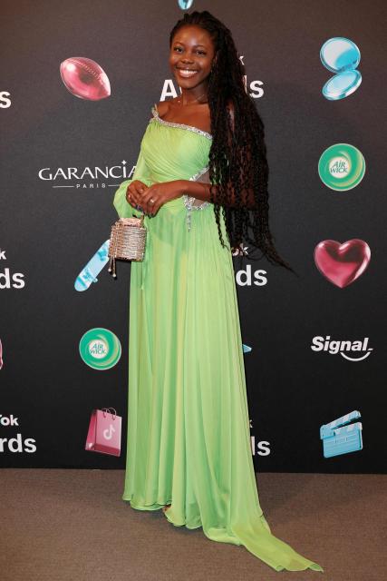 TikToker known as "La Jobsetteuse" poses during the photocall before the third edition of the Tiktok Awards ceremony at the Lido cabaret, in Paris on December 8, 2025. (Photo by Thomas SAMSON / AFP)