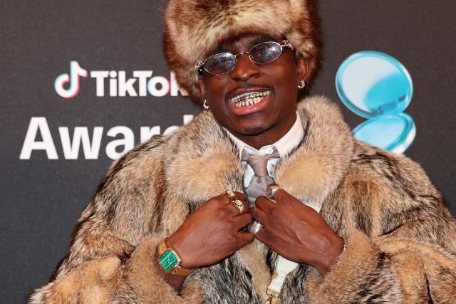 TikToker known as "Maconga20" poses during the photocall before the third edition of the Tiktok Awards ceremony at the Lido cabaret, in Paris on December 8, 2025. (Photo by Thomas SAMSON / AFP)