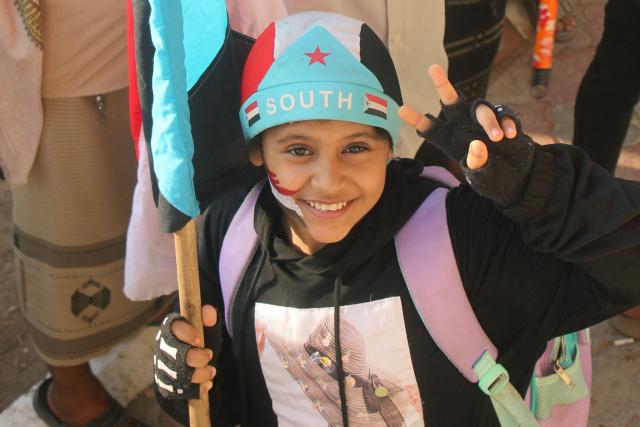 A Yemeni child wearing a hat in the colours of the old South Yemen flag, joins supporters of the UAE-backed Southern Transitional Council (STC), which wants to revive an independent South Yemen, during a rally in Al-Aroud Square demanding a "second independence", in the coastal port city of Aden on December 8, 2025. The STC is part of the internationally recognised government, which is a patchwork of groups held together by their opposition to Yemen's Houthi rebels. The Houthis hold most of the country's populated areas, including the capital Sanaa, in the north and west of the country. (Photo by Handout / AFP)