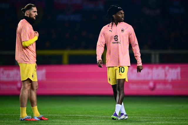 AC Milan's Portuguese forward #10 Rafael Leao and AC Milan's French midfielder  #12 Adrien Rabiot warms up before the Italian Serie A football match between Torino and AC Milan at the Allianz stadium in Turin, on December 8, 2025. (Photo by Marco BERTORELLO / AFP)