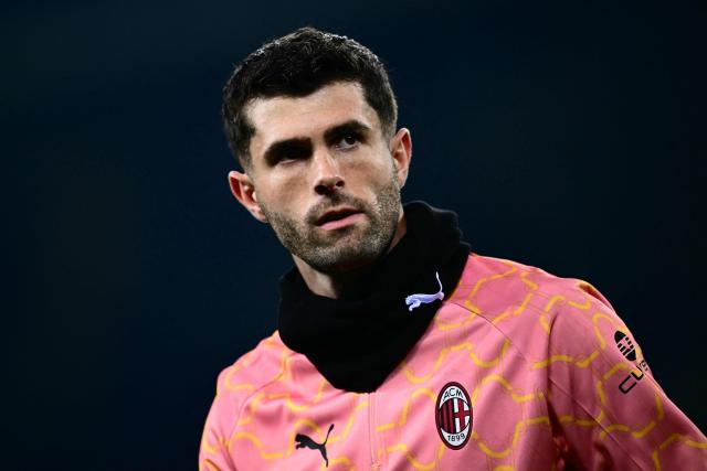 AC Milan's US forward #11 Christian Pulisic warms up before the Italian Serie A football match between Torino and AC Milan at the Allianz stadium in Turin, on December 8, 2025. (Photo by Marco BERTORELLO / AFP)