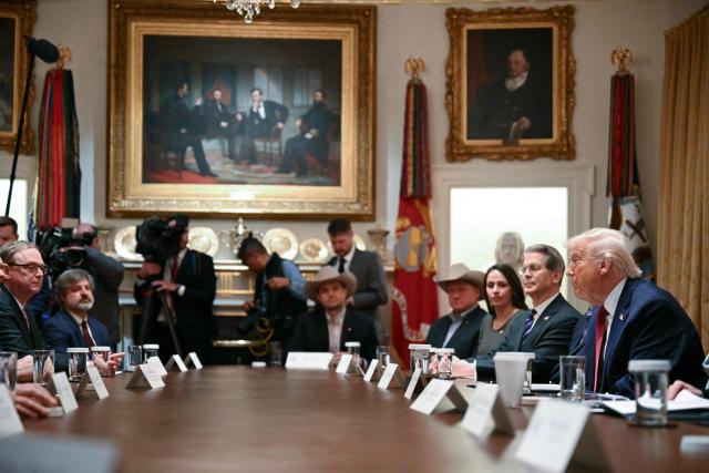 US President Donald Trump participates in a roundtable event to discuss aid for farmers, in the Cabinet Room of the White House in Washington, DC, on December 8, 2025. President Trump is announcing a $12 billion aid package for US farmers, targeting a key support base hit by his trade policies. Since Trump's return to the White House in January, many US farmers have been battered by impacts of his wide-ranging tariffs, including retaliatory measures from trading partners. (Photo by ANDREW CABALLERO-REYNOLDS / AFP)